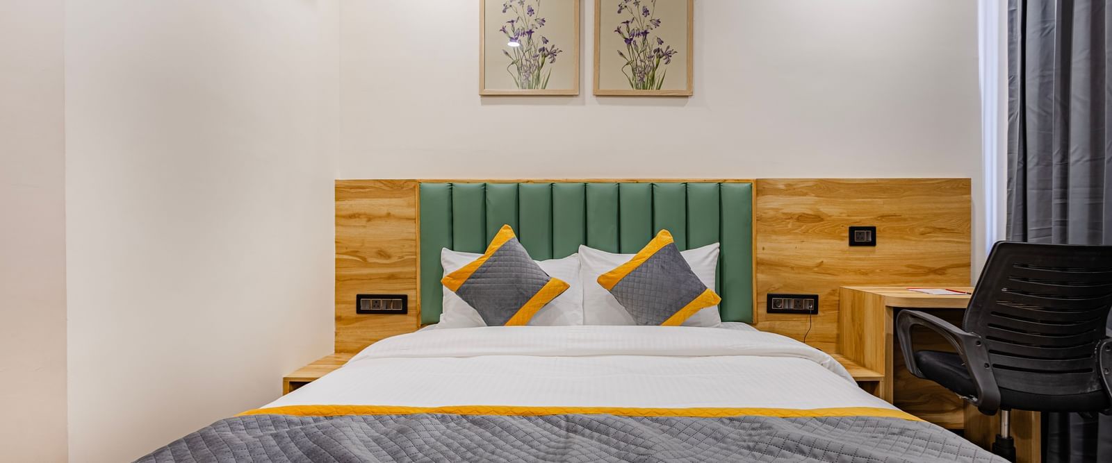 Lemonridge Hotels, KPHB | Lemon Ridge Hotels, KPHB: Hotel room with a double bed, headboard, and artwork on the wall. Clean and simple design.